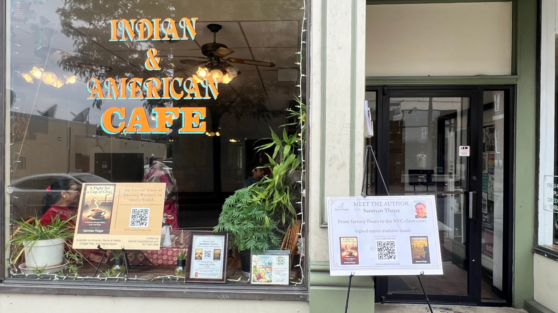 Meet the author signage outside the cafe hosting the launch