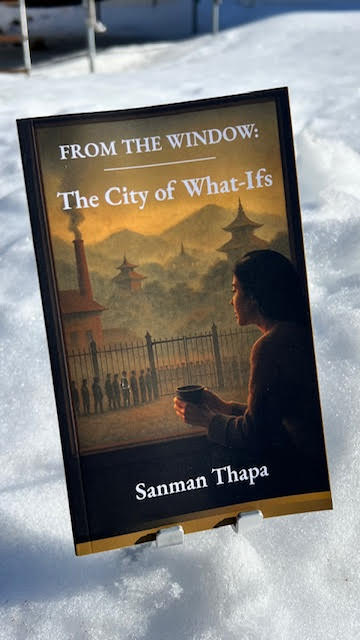 Printed copy of the book standing in snow